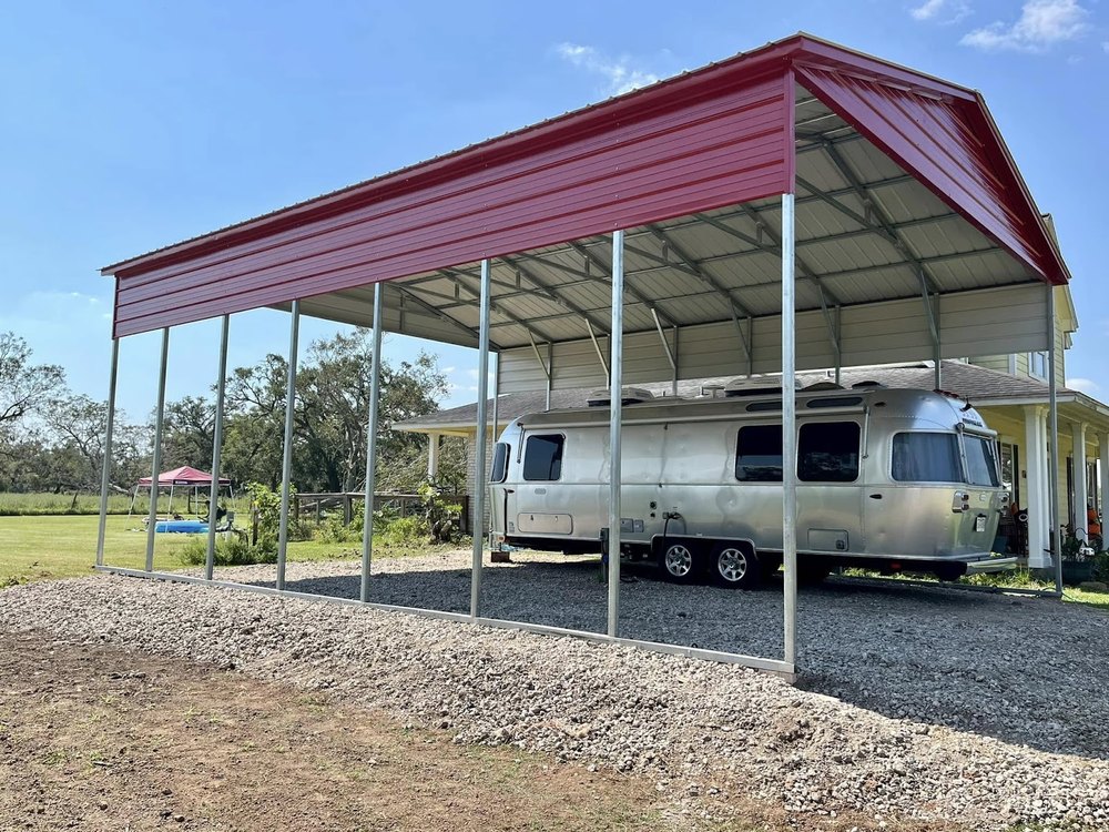 A finished RV pad with gravel and a carport built by DBK Dirt Works